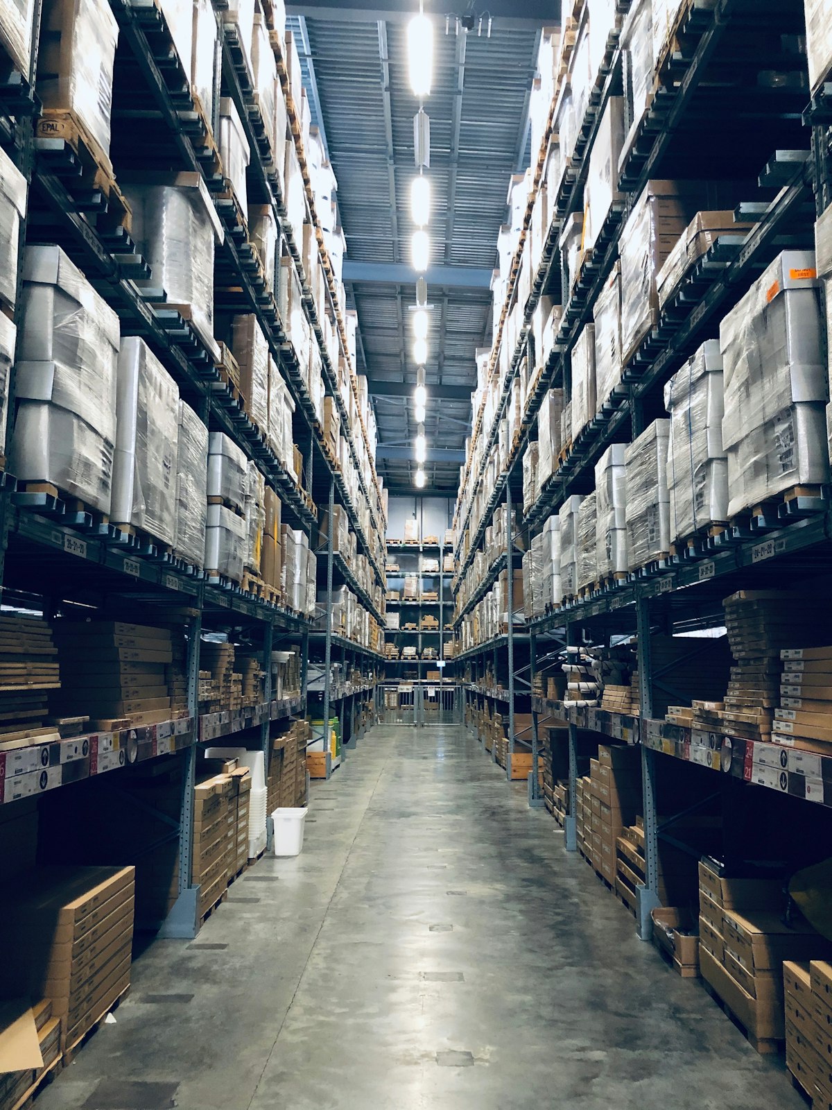 Modern self storage facility aisle with orange doors